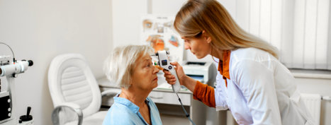 elderly woman getting an eye check up