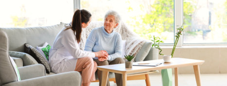 doctor and elderly woman smiling