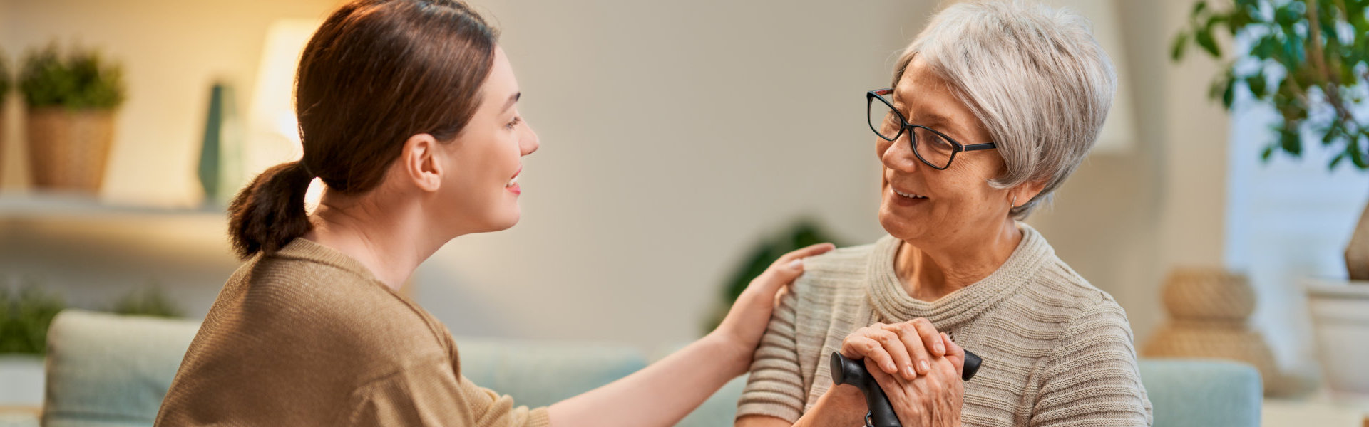 Elderly and young woman spending time together