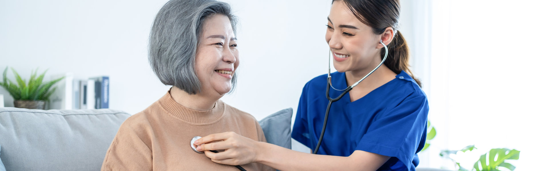 caregiver take care of elderly woman