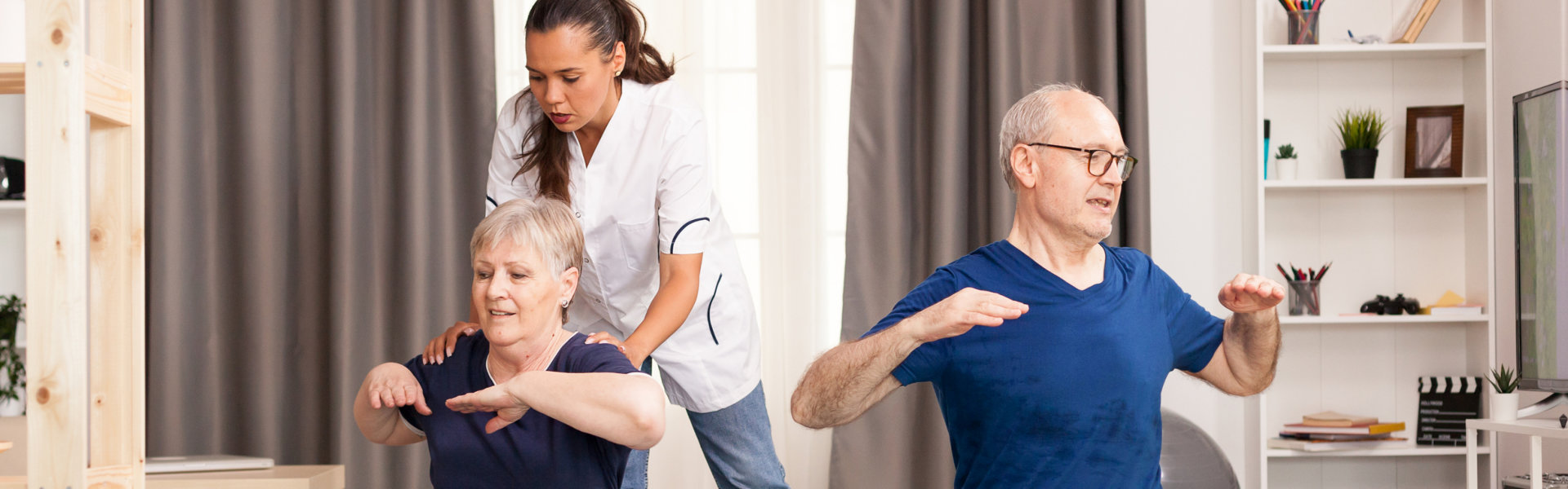 caregiver assessing the elderly to exercise