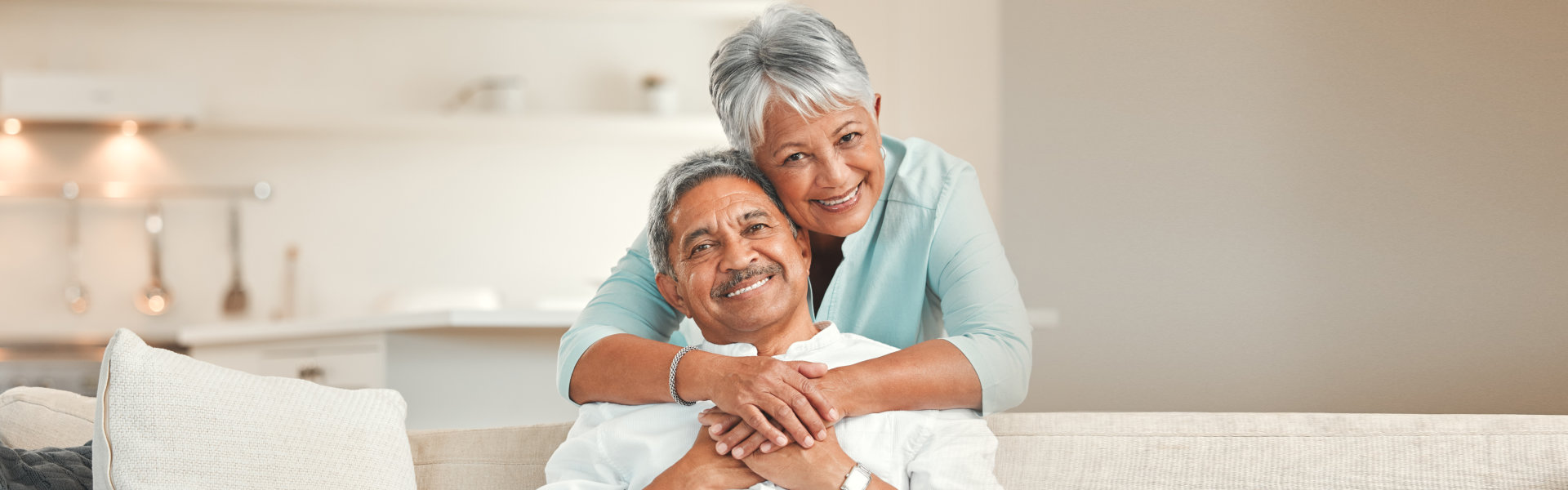 elderly woman hugging the elderly man